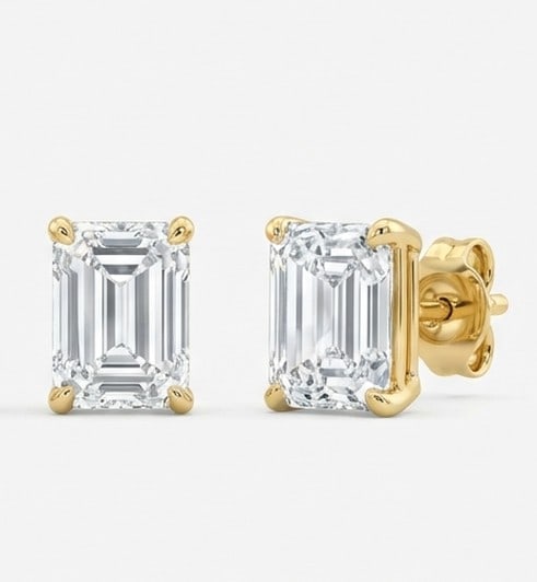 3 Ct Lab Grown Diamond Emerald Cut Studs Ring in 14K Yellow Gold: Title: 3 Ct Lab Grown Diamond Emerald Cut Studs Ring in 14K Yellow Gold Description: Stunning 3 carat lab grown diamond ring featuring a Emerald Cut Studs design. The center stone is beautifully showc