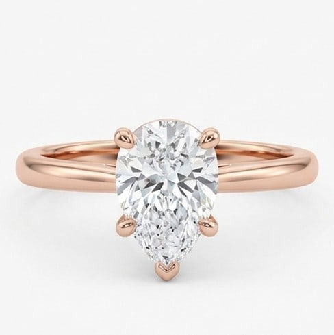 5 Ct Lab Grown Diamond Pear Shape Solitaire Ring in 14K Rose Gold: Title: 5 Ct Lab Grown Diamond Pear Shape Solitaire Ring in 14K Rose Gold Description: Stunning 5 carat lab grown diamond ring featuring a Pear Shape Solitaire design. The center stone is beautifully s