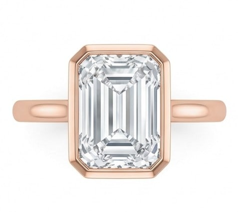8 Ct Lab Grown Diamond Emerald Cut Bezel Set Solitaire Ring in 14K Rose Gold: Title: 8 Ct Lab Grown Diamond Emerald Cut Bezel Set Solitaire Ring in 14K Rose Gold Description: Stunning 8 carat lab grown diamond ring featuring a Emerald Cut Bezel Set Solitaire design. The center