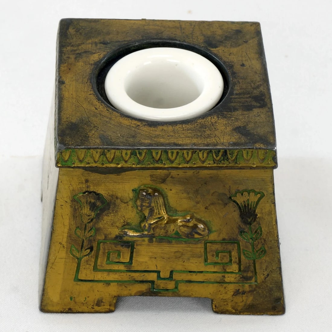 Egyptian Revival Tut Mania Inkwell Circa 1920: Title:Egyptian Revival Tut Mania Inkwell Circa 1920Size:2 3/4 (7.0 cm) in x 2 3/4 (7.0 cm) in x 2 1/4 in (5.7 cm) tall.Description:An antique inkwell from the period that King Tut's treasures were