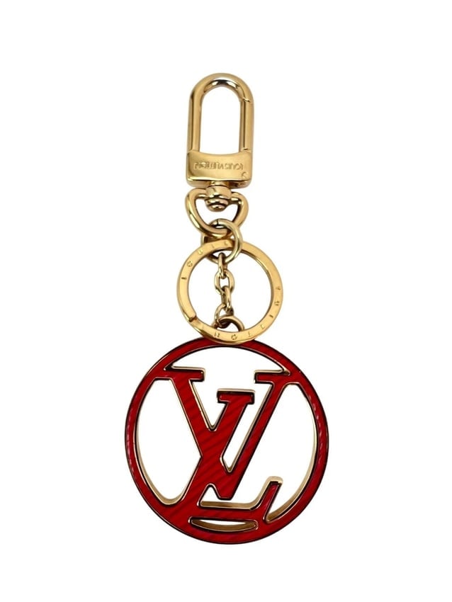 Louis Vuitton LV Circle Key Holder Charm: Title: Louis Vuitton LV Circle Key Holder CharmDescription:"Pre-Owned 100% AuthenticLouis Vuitton LV Circle Key Holder CharmDual function as bag charm and key holderRATING: A/B...Very Good, well maint
