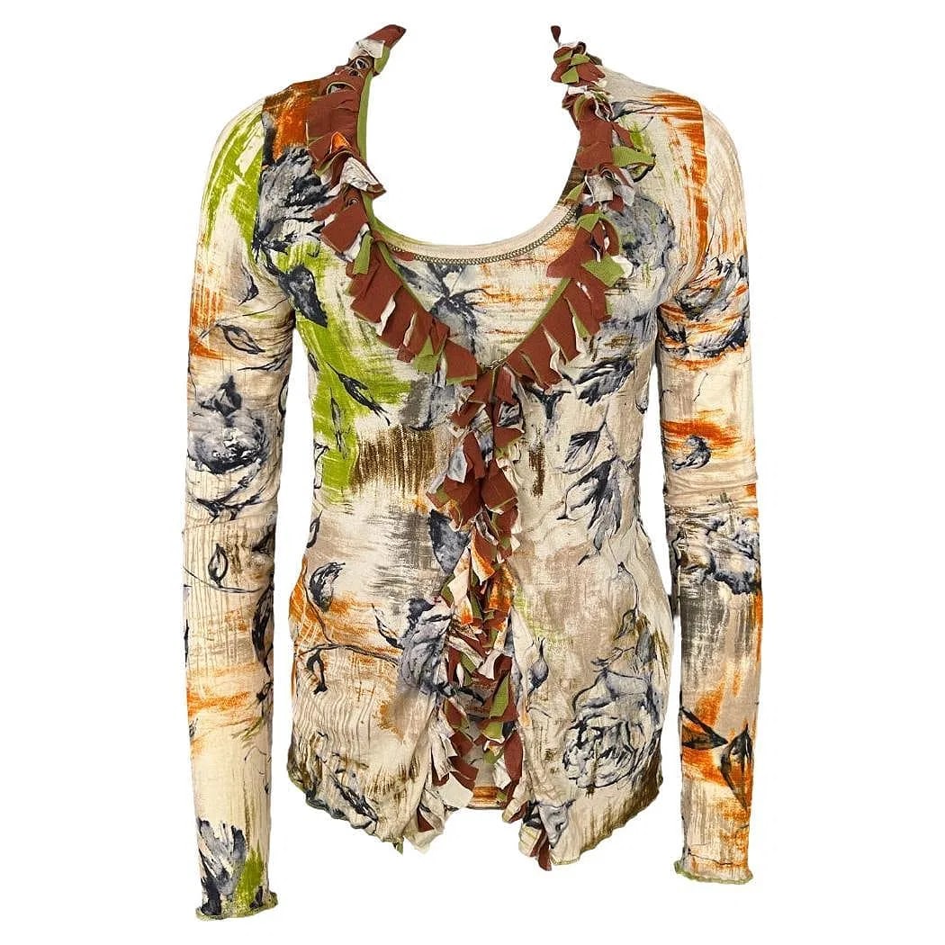 Fuzzi Multicolored Cardigan and Top Set: DescriptionThe cardigan: Features there front metal hooks closure Long sleeves Vneckline Measurements: Length is 26”, waist is 32”, waist is 27”. The top: Sleeveless Crew neck line F