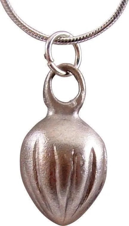 ANCIENT ROMAN SHELL PENDANT, C.100-400 A.D.: Silvered bronze. Over 3/4" height. Large domed form, the back hollowed. Romans were very dependent on the sea and used sea motifs, real and mythical extensively in their art and decor. These are