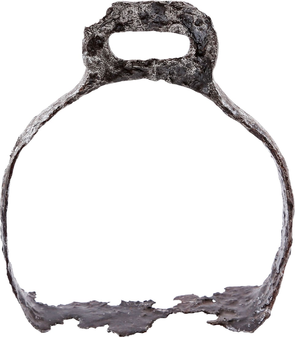 RARE VIKING STIRRUP, 9TH-10TH CENTURY: Good example of Scandinavian form with the characteristic block strap mount. 4 7/8" height with high arched frame of tapered rounded section arms. Rectangular foot rest. Spade form oval top mount
