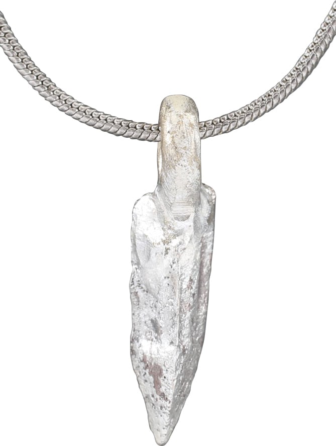 ROMAN TRIANGULAR ARROWHEAD NECKLACE FIRST CENTURY AD.: The time of Christ. Bronze just over 5/8" long of triangular section with delineated vein edges. Surface with texture from burial. Professionally refurbished with a silver overlay and mounted on an 18
