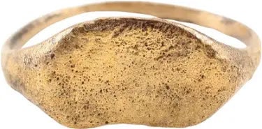 MEDIEVAL EUROPEAN RING C.1200-1500 AD, SIZE 11 1/2: North European, gilt bronze, rare size 11 1/2 with 1.7mm rounded face band broadly flared to the shoulders and kidney-shaped bezel with remnants of an incised design, possibly runes. See Ancient Rings