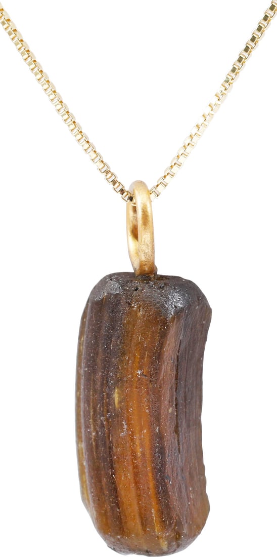 ROMAN GLASS BRACELET SEGMENT C.100-400 AD: A short segment of a Roman woman’s glass bracelet of the late Imperial period. About ¾” length of dark amber hand wound glass. Suspended from an 18" gilt Sterling silver neck chain