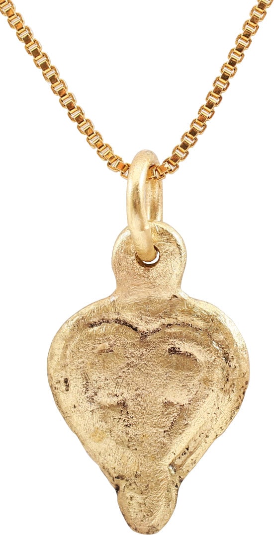 FINE VIKING HEART PENDANT PENDANT, C.10TH-11TH CENTURY AD: 18.2mm, 0.72" total height. Elegant form with a rudimentary cusp to the top and pointed bottom. Broad rounded edge and high relief, central trefoil with a heart border. A heart in a heart! Made by