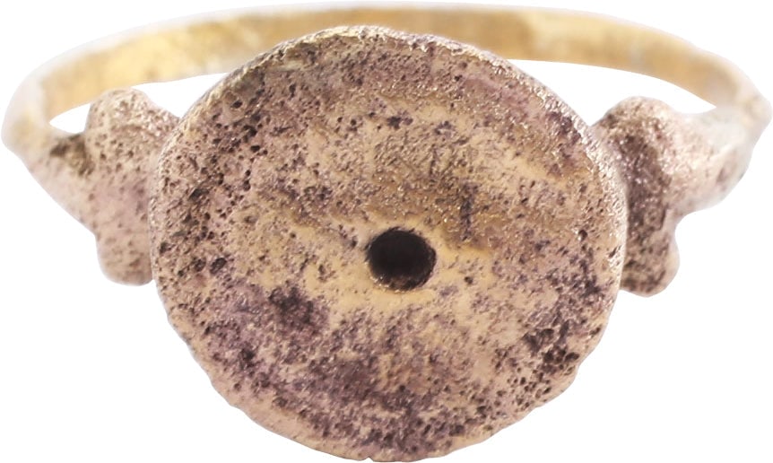 ROMAN EVIL EYE RING, 1ST-3RD C. AD, SIZE 10: Gilt bronze, size 10. Round section band, 1.7mm thick. Raised round bezel with concentric circles representing the eye. Intended to protect the wearer against those empowered to inflict misfortune and