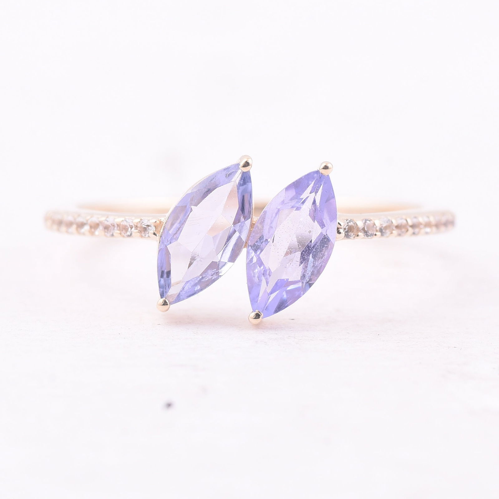 0.93 Ct Marquise Tanzanite 9K Gold Ring: Title: 0.93 Ct Marquise Tanzanite 9K Gold Ring Description: 0.93 Total Carat Tanzanite 9K Gold Ring Specifications - Total Weight 1.499 g - Center Gemstone Tanzanite - Gemstone Carat Weight 0.85