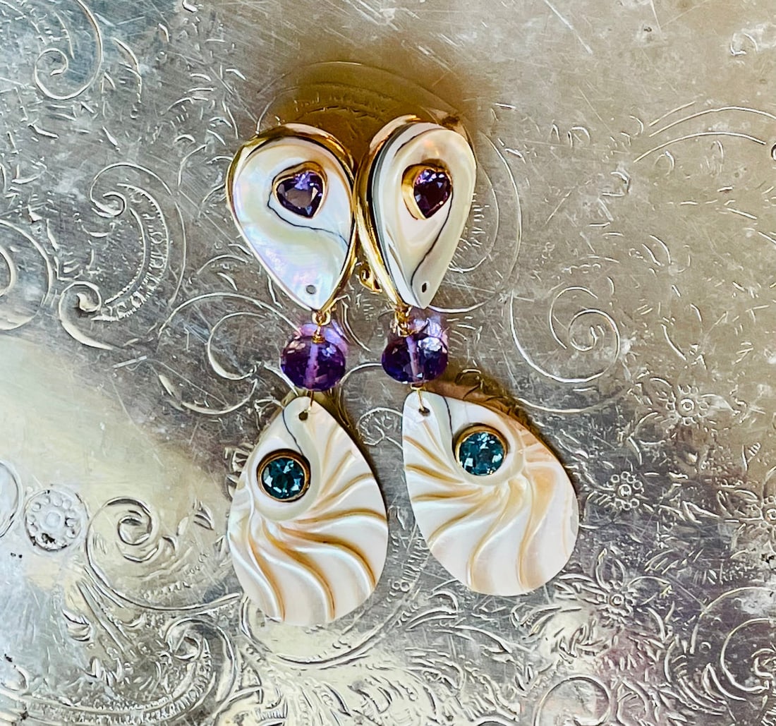 Nautilus Earrings With Amethyst and Swiss Blue Topaz: Title:Nautilus Earrings With Amethyst and Swiss Blue TopazDescription:Fun and fanciful Mother of Pearl and Nautilus Heart drop earrings set with brilliant Amethyst and Swiss Blue Topaz stones.
