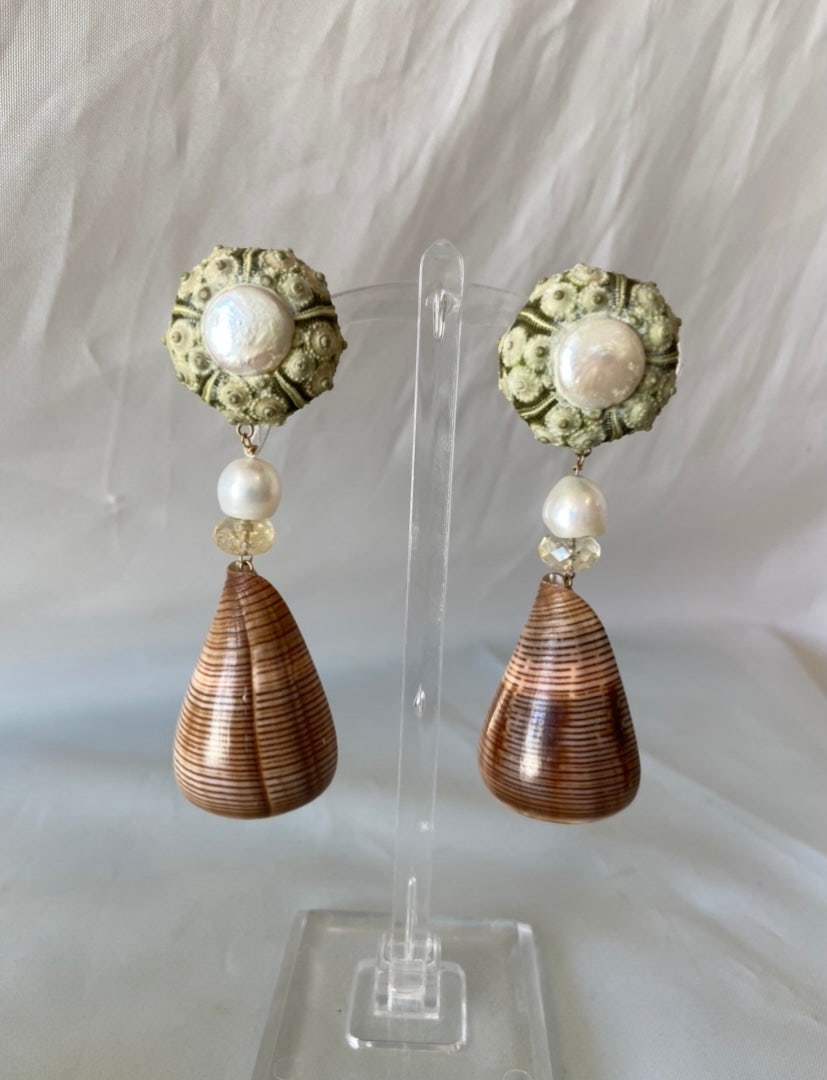 Brown Cone & Urchin Earrings: Title:Brown Cone & Urchin EarringsDescription:These beautiful and unique earrings are made from Urchin, Pearl, Citrine, and Brown Cone shell. They drop 3" and are clips. Reserve: $340.00 