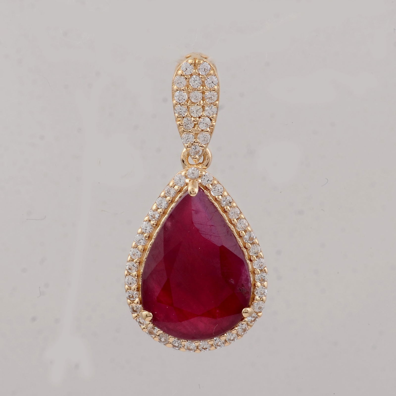 2.64 Ct Pear Ruby 9K Gold Pendant: Title:2.64 Ct Pear Ruby 9K Gold Pendant Description:2.64 Total Carat Ruby 9K Gold Pendant Specifications - Total Weight 1.31 g - Center Gemstone Ruby - Gemstone Carat Weight 2.43 Carats - Gemstone Mea