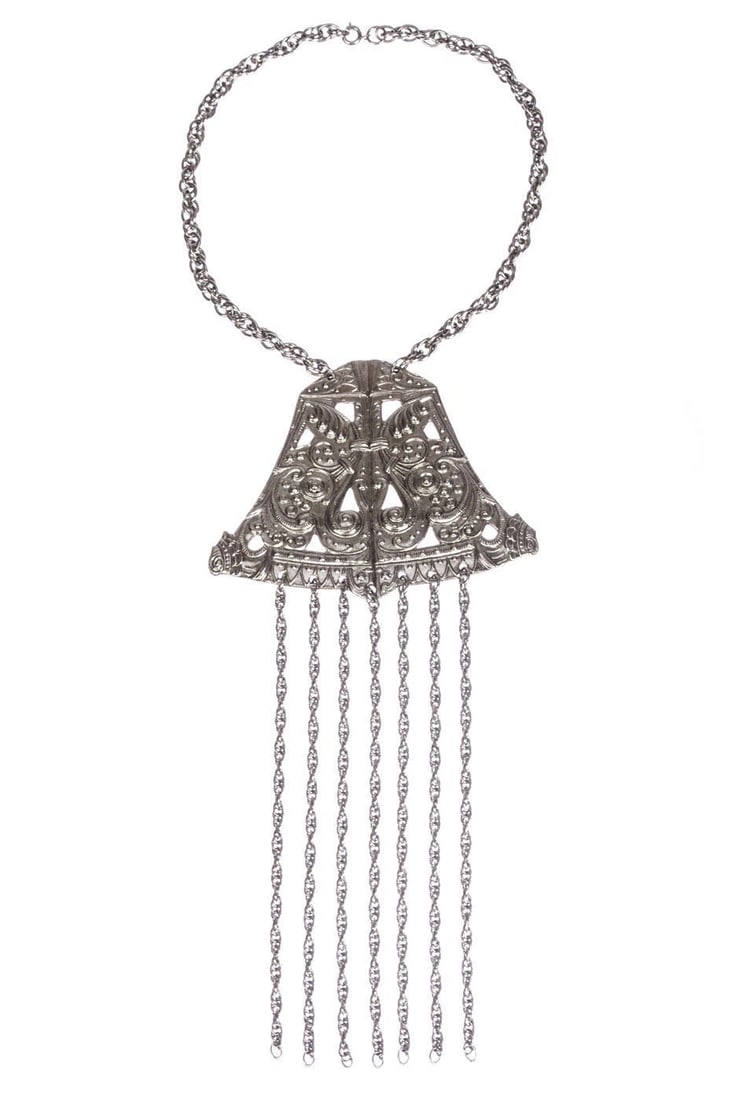 Vintage Silver Tone Etruscan Inspired Bell Tassel Necklace: Title:Vintage Silver Tone Etruscan Inspired Bell Tassel NecklaceDescription:Intricate design in this costume silvertone metal tassel necklace. Circa, 1970’s. Necklace measures, 16”
