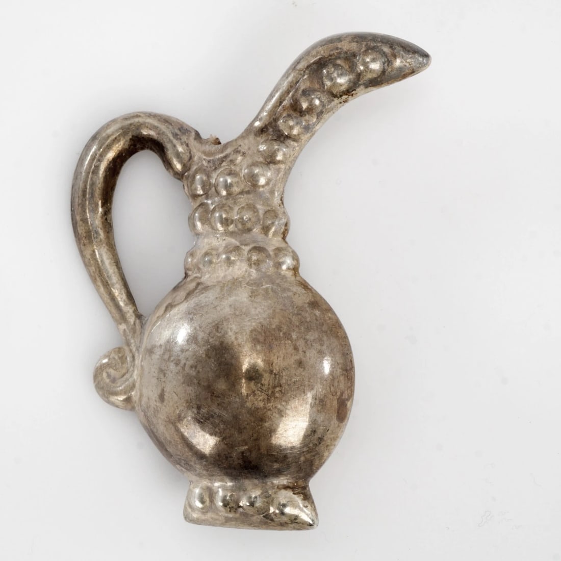 Large Mexican Silver Pin/Brooch: Title:Large Mexican Silver Pin/BroochSize:2 ½ in (6.4 cm) tall.Description:A classic vintage Mexican silver pin in the shape of a pitcher. It has lovely details. Stamped “Mexican Silver in