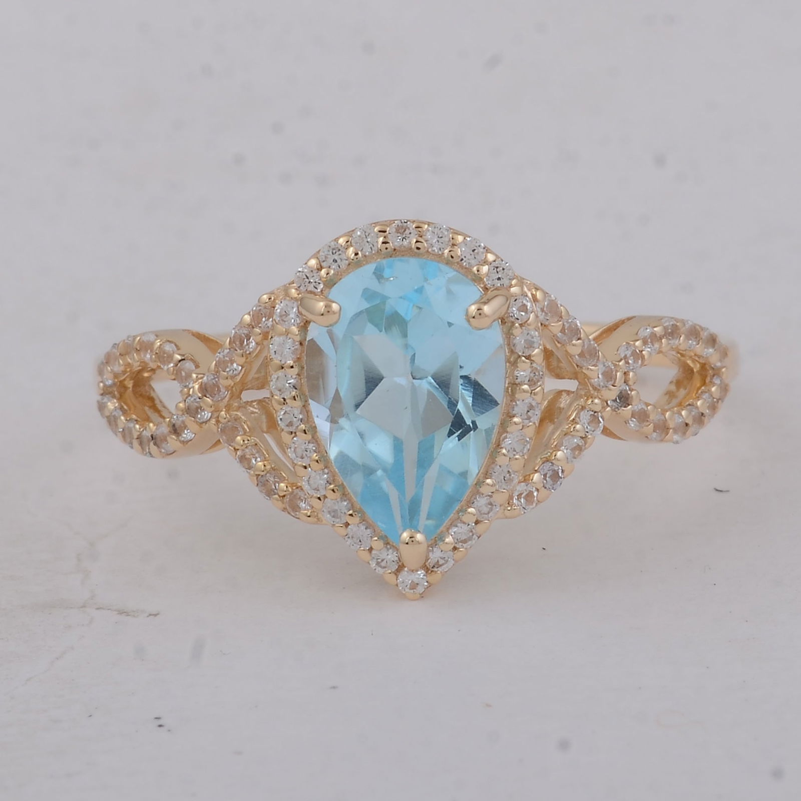 1.87 Ct Pear Blue Topaz 9K Gold Ring: Title:1.87 Ct Pear Blue Topaz 9K Gold RingDescription:1.87 Total Carat Blue Topaz 9K Gold Ring Specifications - Total Weight 2.01 g - Center Gemstone Blue Topaz - Gemstone Carat Weight 1.55 Carats -