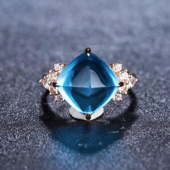 14K GOLD 11.11 CTW NATURAL TOPAZ & SAPPHIRE RING: Title:14K GOLD 11.11 CTW NATURAL TOPAZ & SAPPHIRE RINGDescription:Ref:230528388Gold Content:14K GoldRing Size:7.25USMain Gemstone:TopazNumber of stones:1Shape:Suger-LoafCarat Weight:10.5ct