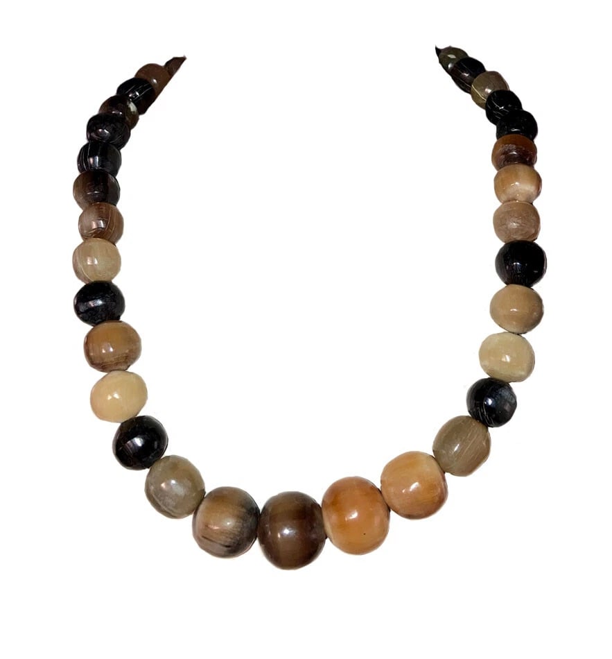 Mexican Artisan Bull Horn Round Bead Necklace: Title:Mexican Artisan Bull Horn Round Bead NecklaceDescription:Mexican Artisan bull horn round bead necklace, yellow, black, clear, and grey present. Gorgeous shiny smooth beads, hand made in