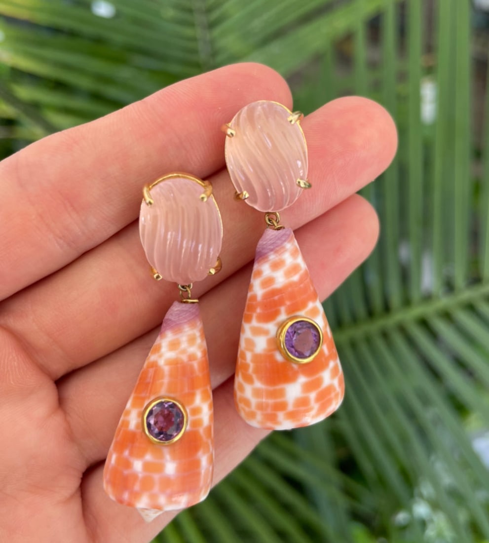 Pink Quartz & Conus Shell Earrings: Title:Pink Quartz & Conus Shell Earrings Description:Pair of wonderful, carved Pink Quartz tops with charming Conus Tessellates shells set with faceted, lilac Sapphires. Pierced Vermeil. Reserve: $512