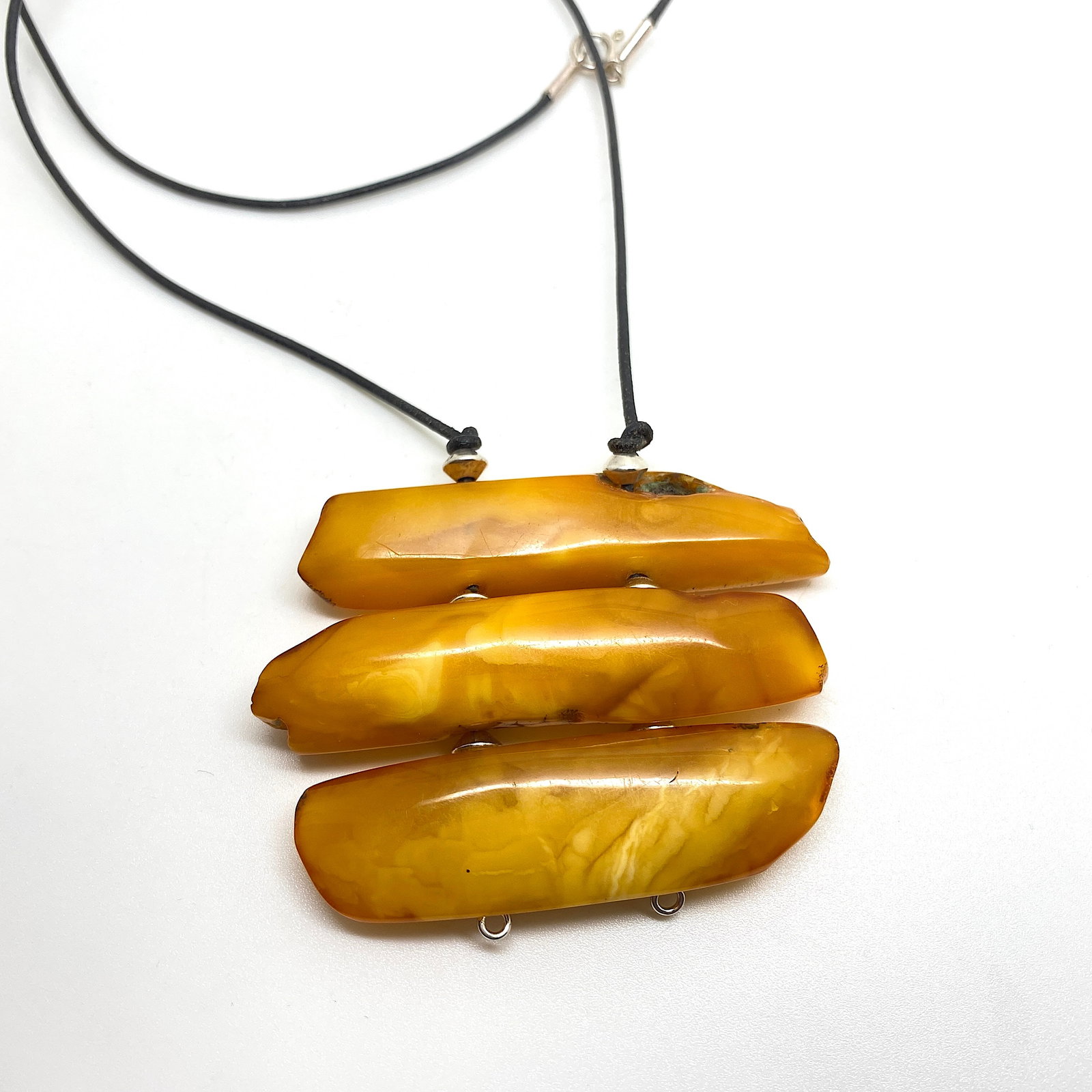 Marvellous Amber Pendant: Title:Marvellous Amber PendantMetal:NoneGemstone:AmberWeight:24.0 gSize:Size: 50.0 x 69.0 x 11.0 mm Size: 1.969 x 2.717 x 0.433 inches Made of:(Reconstituted Amber or Whole Stone):Whole
