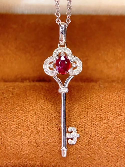18k Natural Ruby Pendant: Title: 18k Natural Ruby Pendant Description: 18k Natural Ruby Pendant (Chain not Included) Main Stone: 0.4 Carats Diamonds: 37 Reserve: $900.00 Shipping:Domestic: Shipping rates are determined by