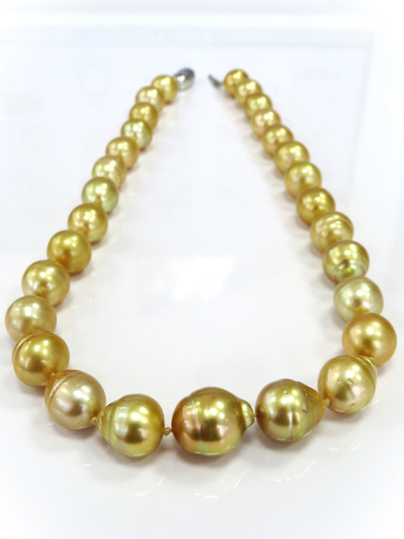 12-15mm Drop/Circle-Baroque Dark Golden South Sea Pearl Necklace: Title:12-15mm Drop/Circle-Baroque Dark Golden South Sea Pearl Necklace Description:A-AA Grade High luster Dark Golden Drop/Circle-Baroque, with minimal spots/blemishes, 29 pearl pieces, 18 inches