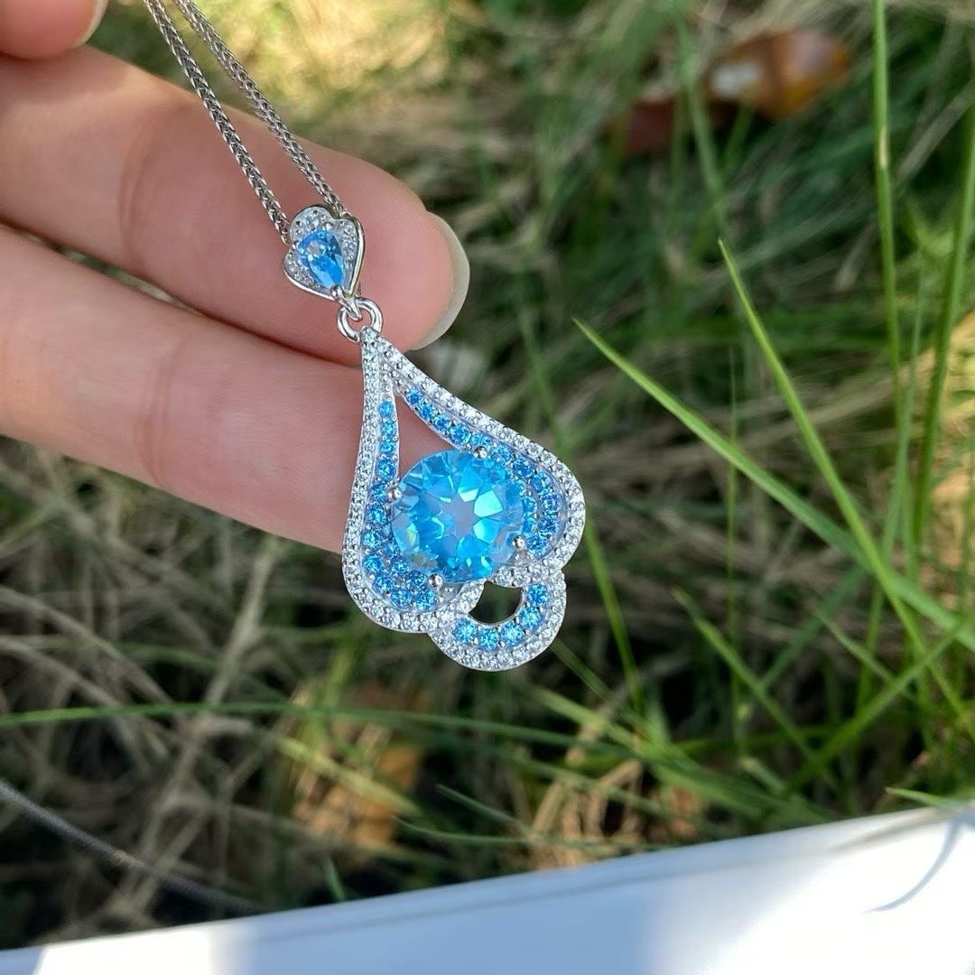 925 silver natural topaz pendant: Title: 925 silver natural topaz pendant Description: This 925 silver pendant perfectly showcases the charming allure of natural topaz stone, with the main stone measuring 9.0 millimeters. The