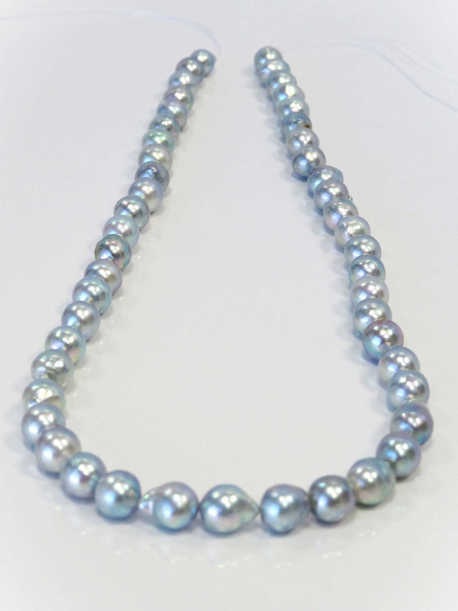 6-8mm Drop-Baroque Blue Akoya Pearl Necklace Strand: Title:6-8mm Drop-Baroque Blue Akoya Pearl Necklace StrandDescription:A-AA Grade High luster, Irridescent Blue Drop-Baroque with minimal spots/blemishes, 49 pearl pieces, 18 inches long hand-knotted
