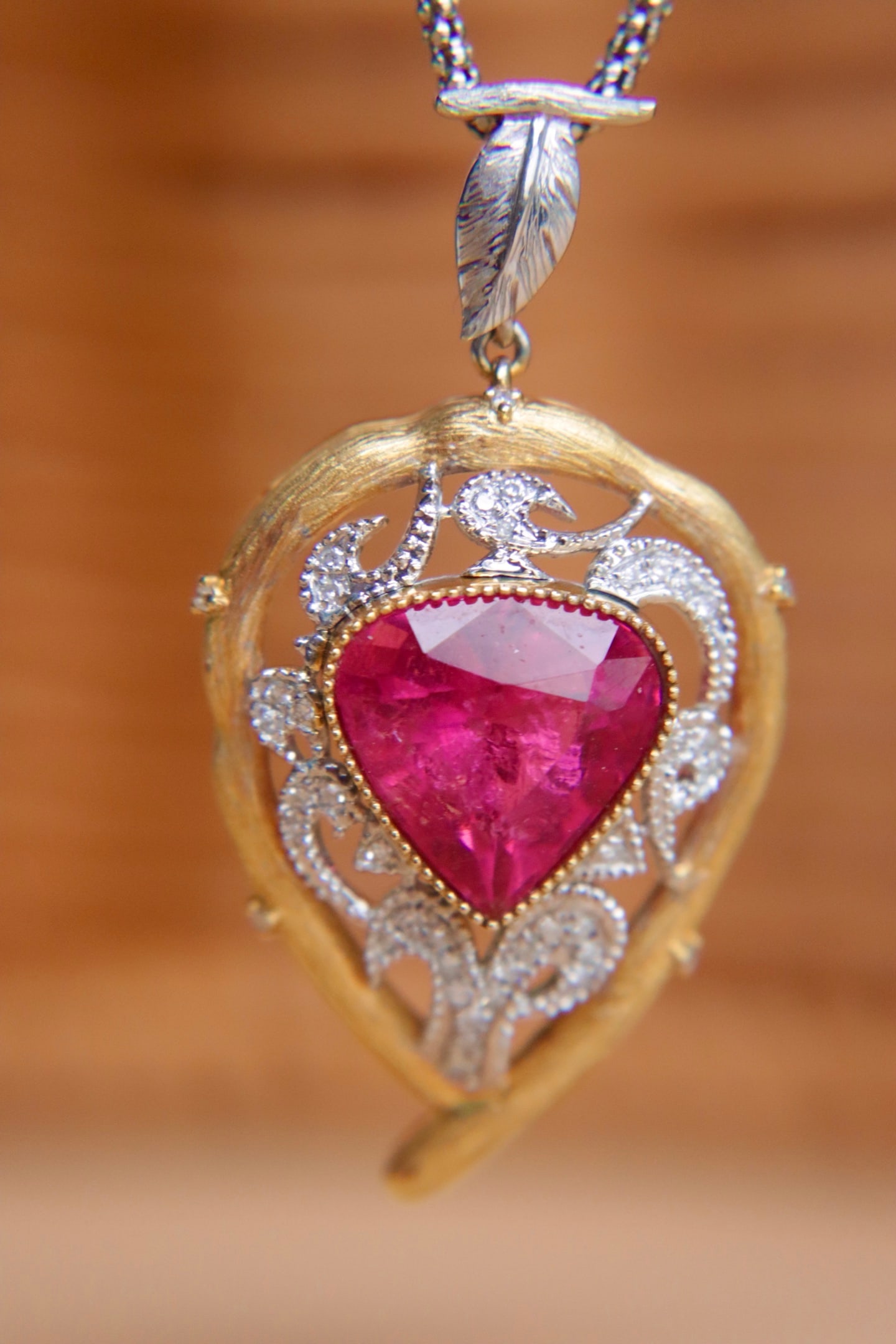 18K Gold Rubellite Tourmaline Pendant: Title: 18K Gold Rubellite Tourmaline Pendant Description: 18K Gold Rubellite Tourmaline Pendant Main stone 5.85ct, two-tone gold process Set with diamonds, beautiful color Reserve: $4,000.00 