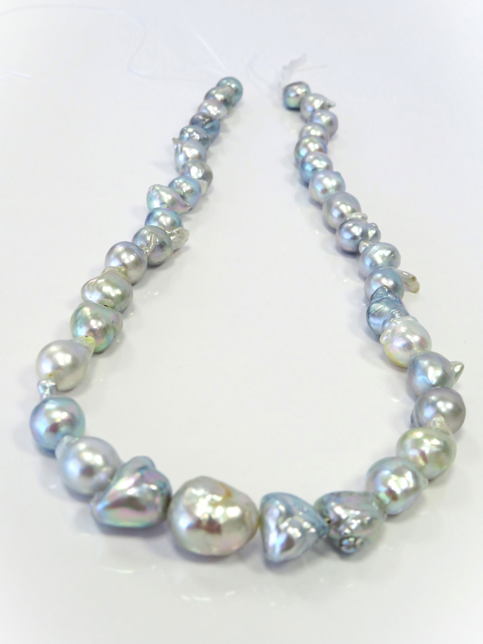 8-12mm Mix Drop-Baroque Blue/White Akoya Pearl Necklace Strand: Title:8-12mm Mix Drop-Baroque Blue/White Akoya Pearl Necklace Strand Description:A-AA Grade High luster, Irridescent White/Blue Drop-Baroque/Free-form with minimal spots/blemishes, 38 pearl pieces, 18