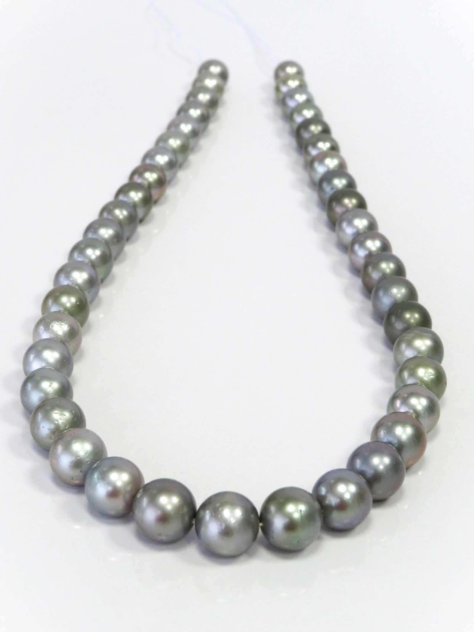 8-11mm Round Silver Tahitian Pearl Necklace Strand: Title:8-11mm Round Silver Tahitian Pearl Necklace Strand Description:A-AA Grade High luster Round, with some spots/blemishes, 41 pearl pieces, 18 inches long hand-knotted with 14k white-gold fish-hook