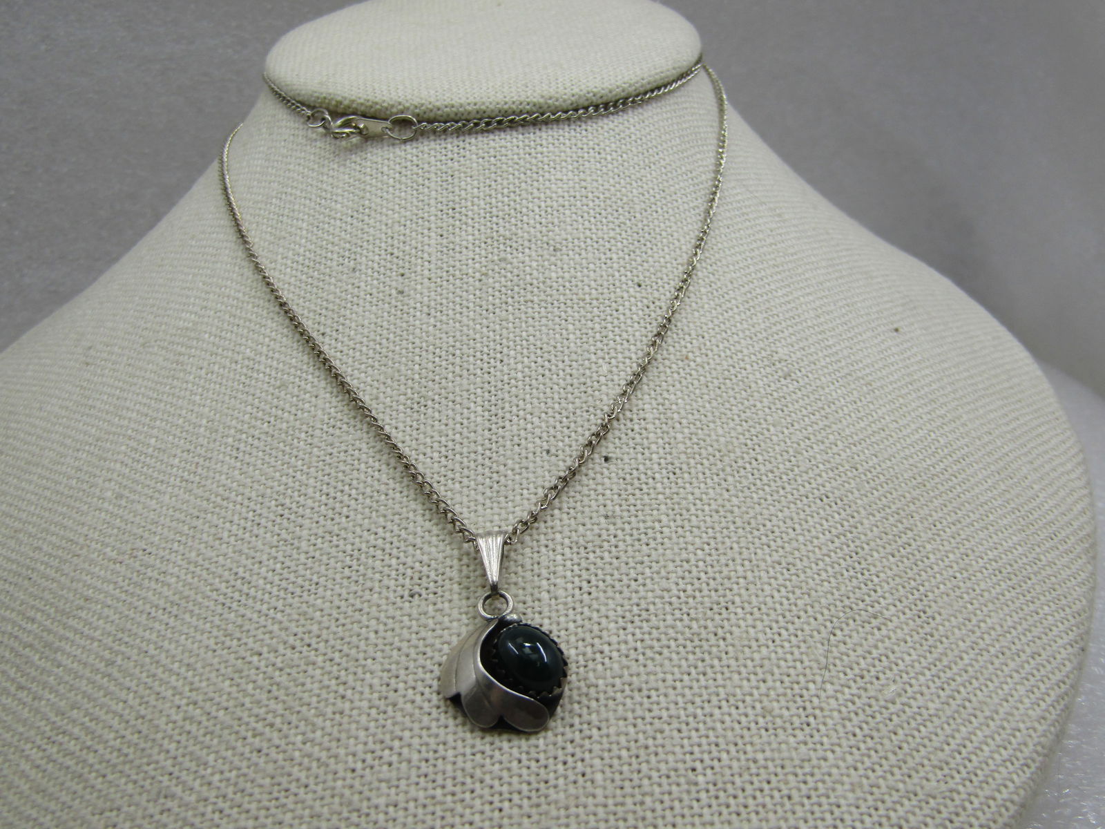 Vintage Sterling Southwestern Green Stone Pendant with 24" Silver Tone Chain: Title: Vintage Sterling Southwestern Green Stone Pendant with 24" Silver Tone Chain Description: Vintage Sterling Southwestern Green Stone Pendant with 24" Silver Tone Chain. The pendant is appx. 1.26