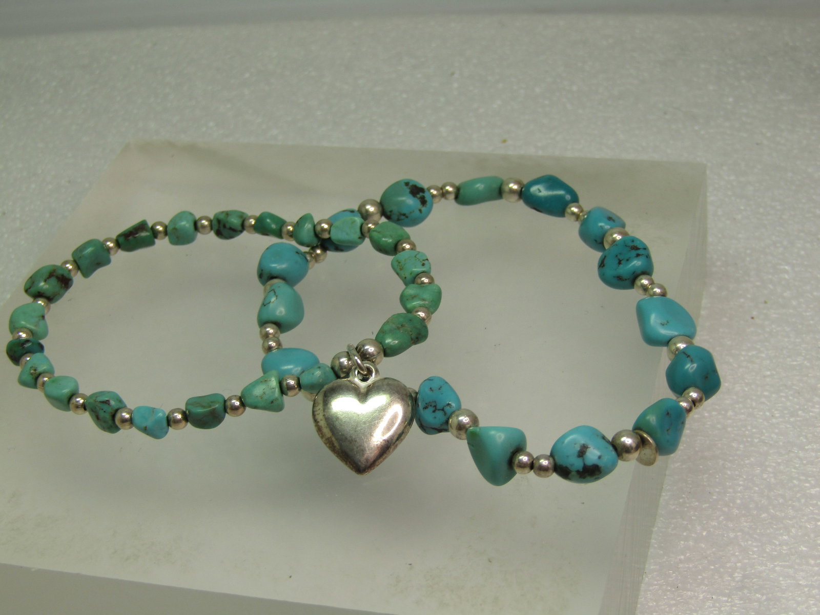 Two Sterling Southwestern Turquoise Bracelet, One Sterling Heart, Stretch, 6.5"/7": Title: Two Sterling Southwestern Turquoise Bracelet, One Sterling Heart, Stretch, 6.5"/7" Description: Two Sterling Southwestern Turquoise Bracelet, Stretch, 6.5"/7". Age estimated at 1980's-1990's. T