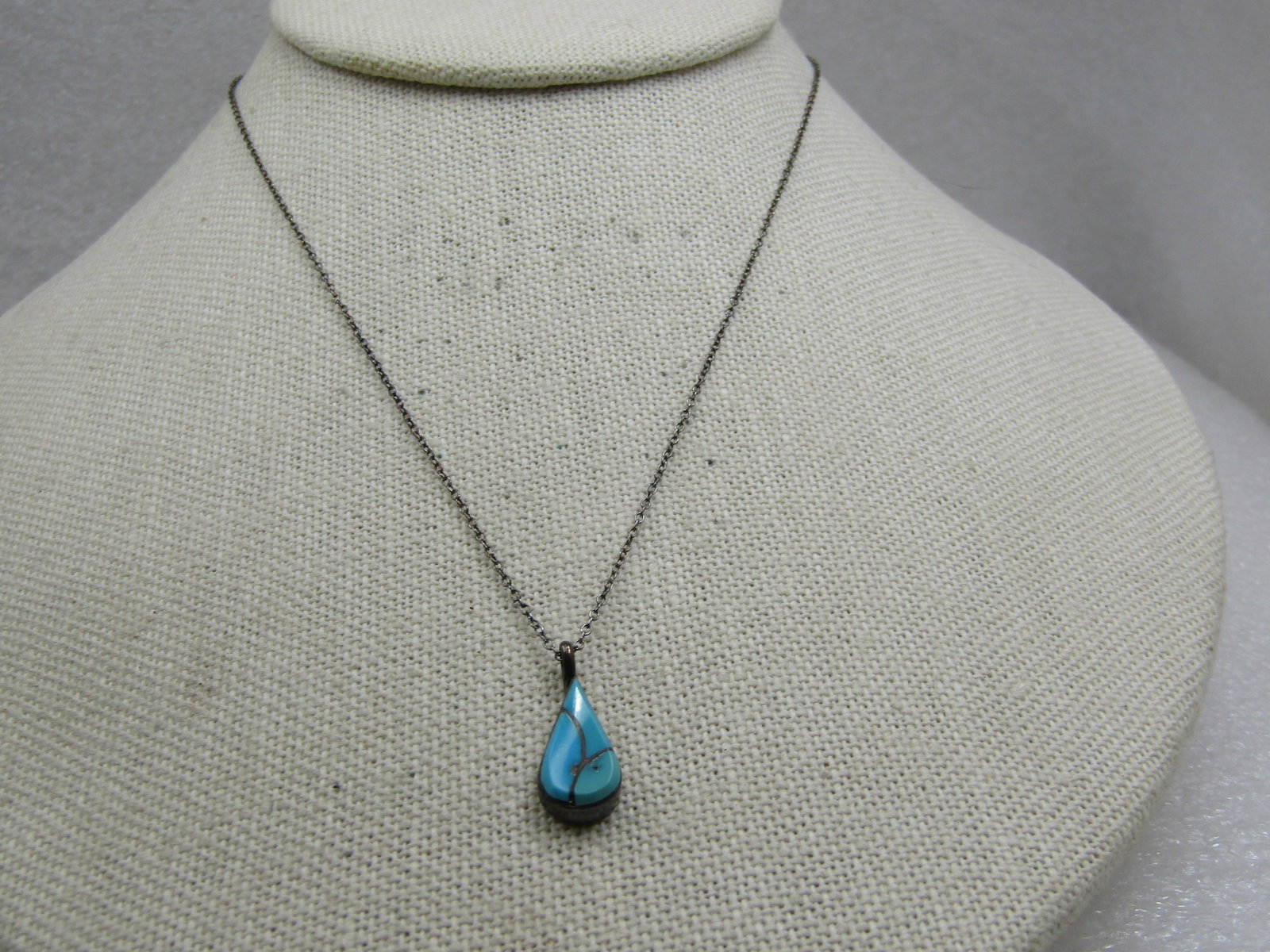 Vintage Sterilng Southwestern Inlaid Turquoise Necklace, 16": Title: Vintage Sterilng Southwestern Inlaid Turquoise Necklace, 16" Description: Vintage Sterilng Southwestern Inlaid Turquoise Necklace, 16". Teardrop shaped inlaid thurquoise pendant with three