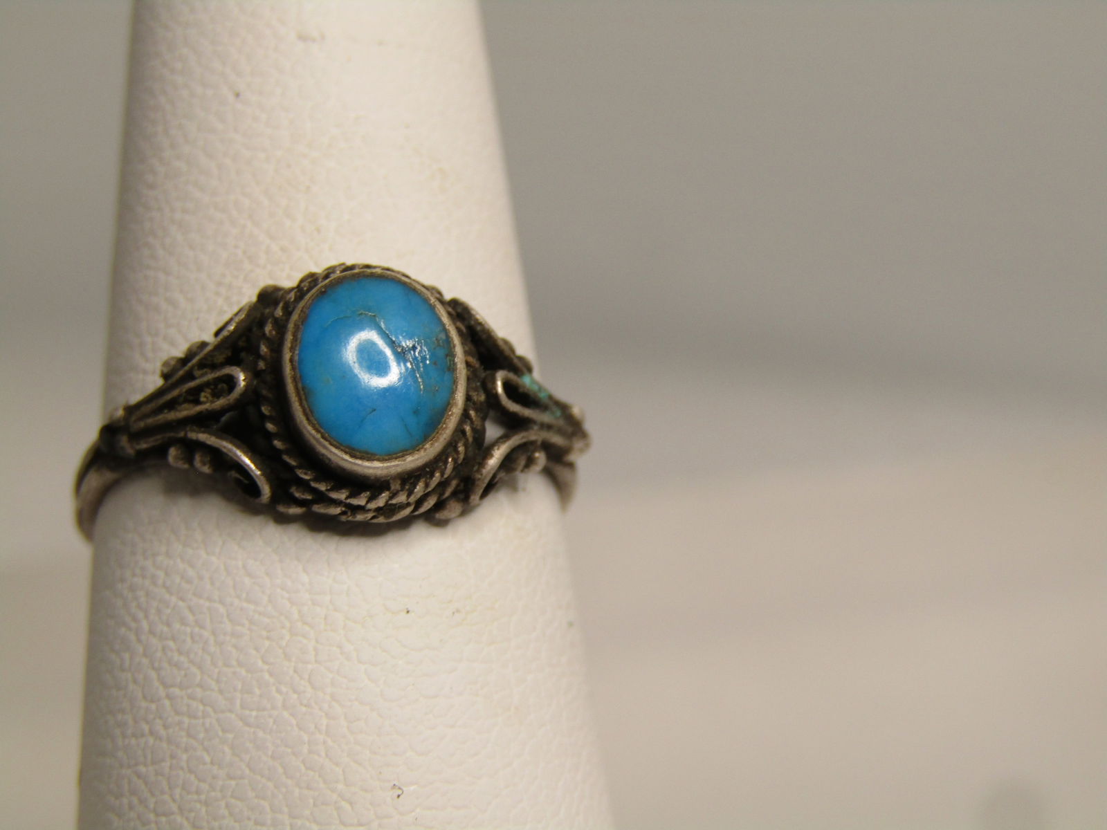 Vintage Sterling Turquoise Bali Ring, Sz. 7.5, 1970's: Title: Vintage Sterling Turquoise Bali Ring, Sz. 7.5, 1970's Description: Vintage Sterling Turquoise Bali Ring, Sz. 7.5, 1970's. This has the bail rope accents and loops and scrolls - could also be