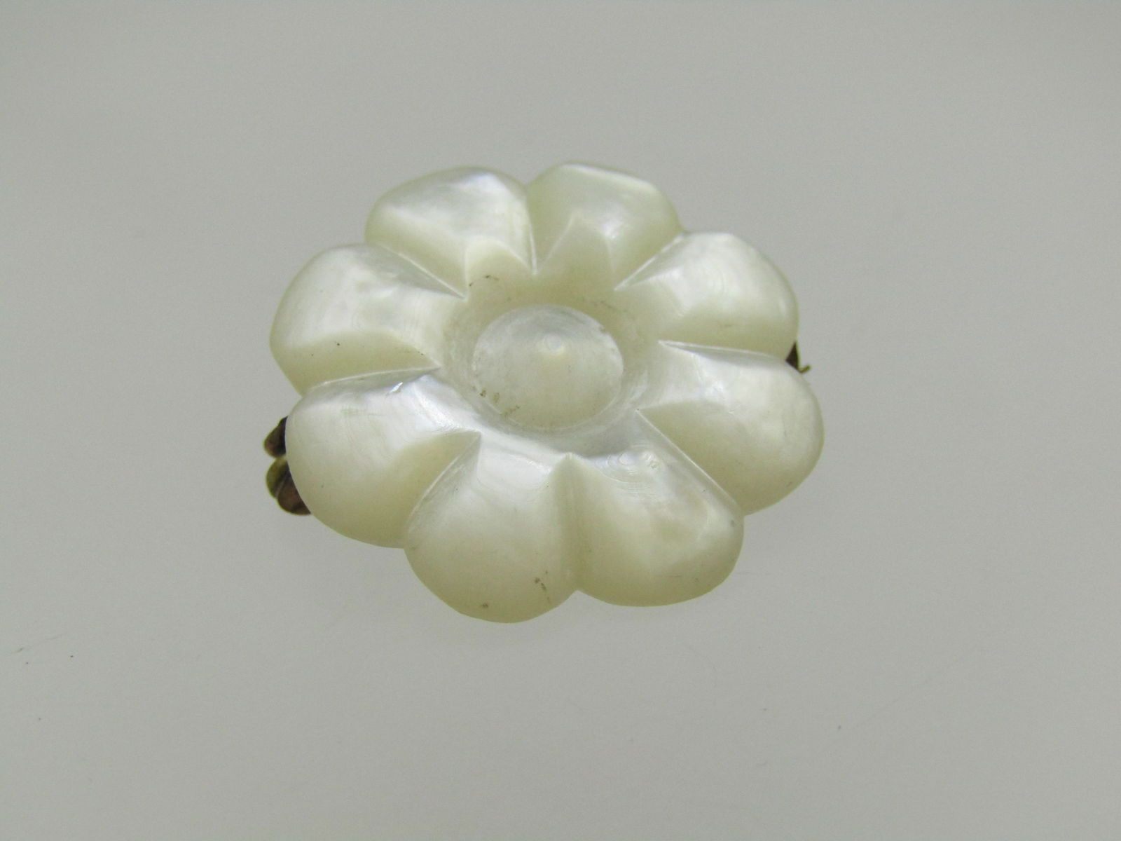 Victorian Carved Mother-of-Pearl Blossom Brooch, C-Clasp, 3/4": Title: Victorian Carved Mother-of-Pearl Blossom Brooch, C-Clasp, 3/4" Description: Victorian Carved Mother-of-Pearl Blossom Brooch, C-Clasp, 3/4". A simple blossoms carved with eight petals and a roun