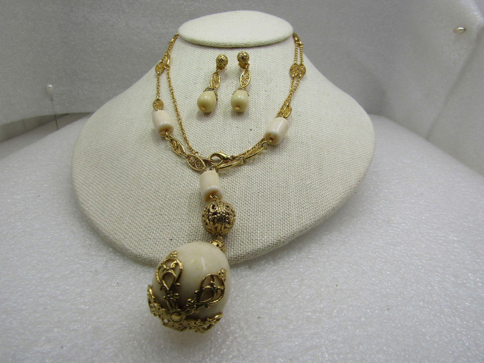Vintage Filigree Tan Beaded Necklace& Earring Set, Signed Avon C.I.: Title: Vintage Filigree Tan Beaded Necklace& Earring Set, Signed Avon C.I. Description: Vintage Filigree Tan Beaded Necklace & Earring Set, Signed Avon C.I. 32" filigree link and chain link necklace w