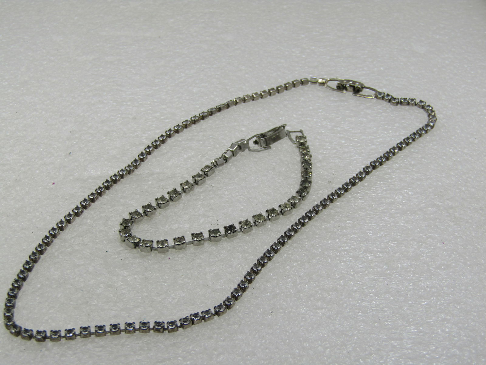 Vintage Rhinestone Chain Necklace & Bracelet Set, 15" and 7": Title: Vintage Rhinestone Chain Necklace & Bracelet Set, 15" and 7" Description: Vintage Rhinestone Chain Necklace & Bracelet Set, 15" and 7". It is a single strand. the necklace is 2mm wide and the b