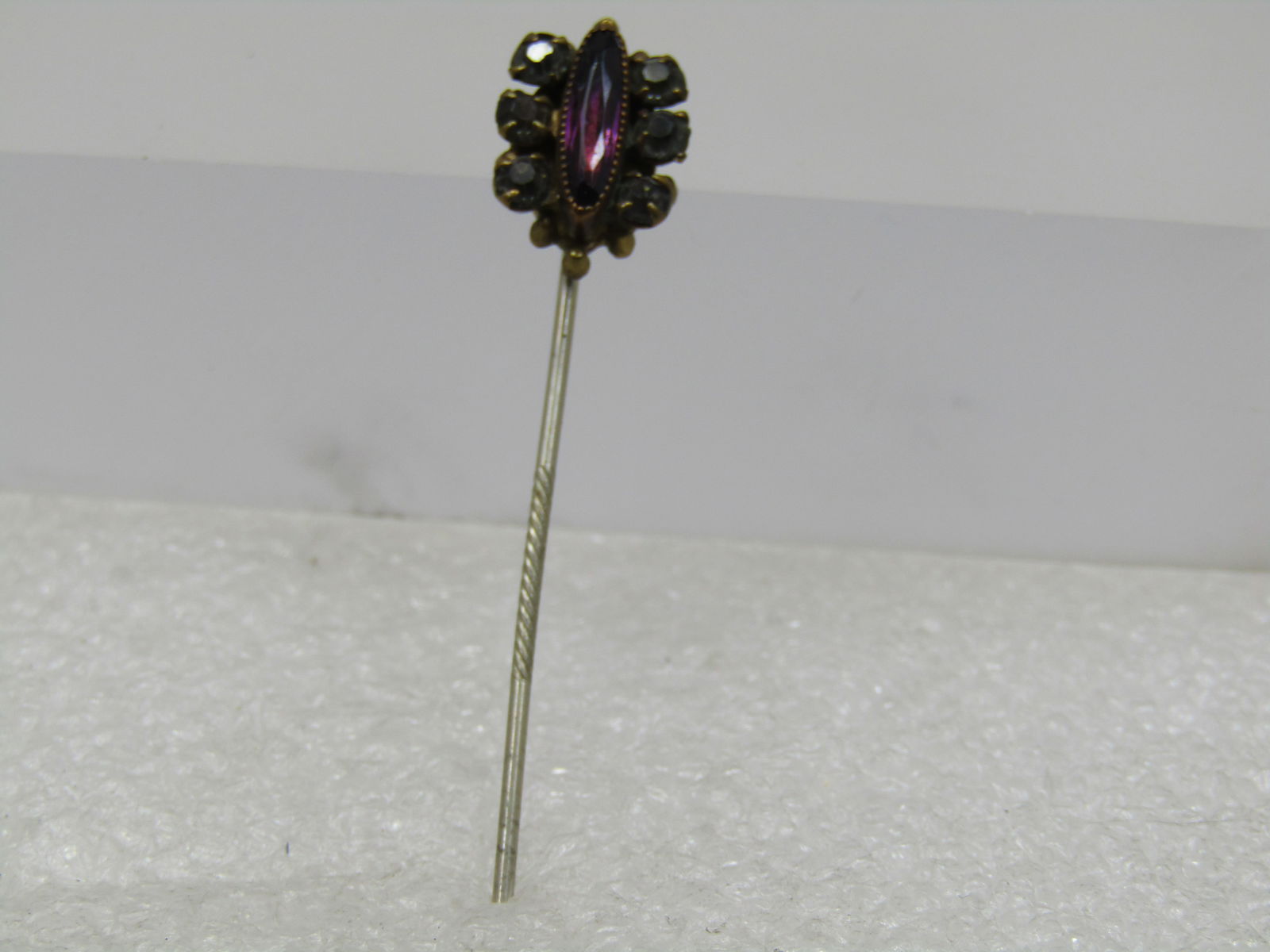 Antique Rhinestone Stick Pin, Purple/Clear, early 1900's: Title: Antique Rhinestone Stick Pin, Purple/Clear, early 1900's Description: Antique Rhinestone Stick Pin, Purple/Clear, 1800's-1900's. 2.5" long with a pin that has the textured center for