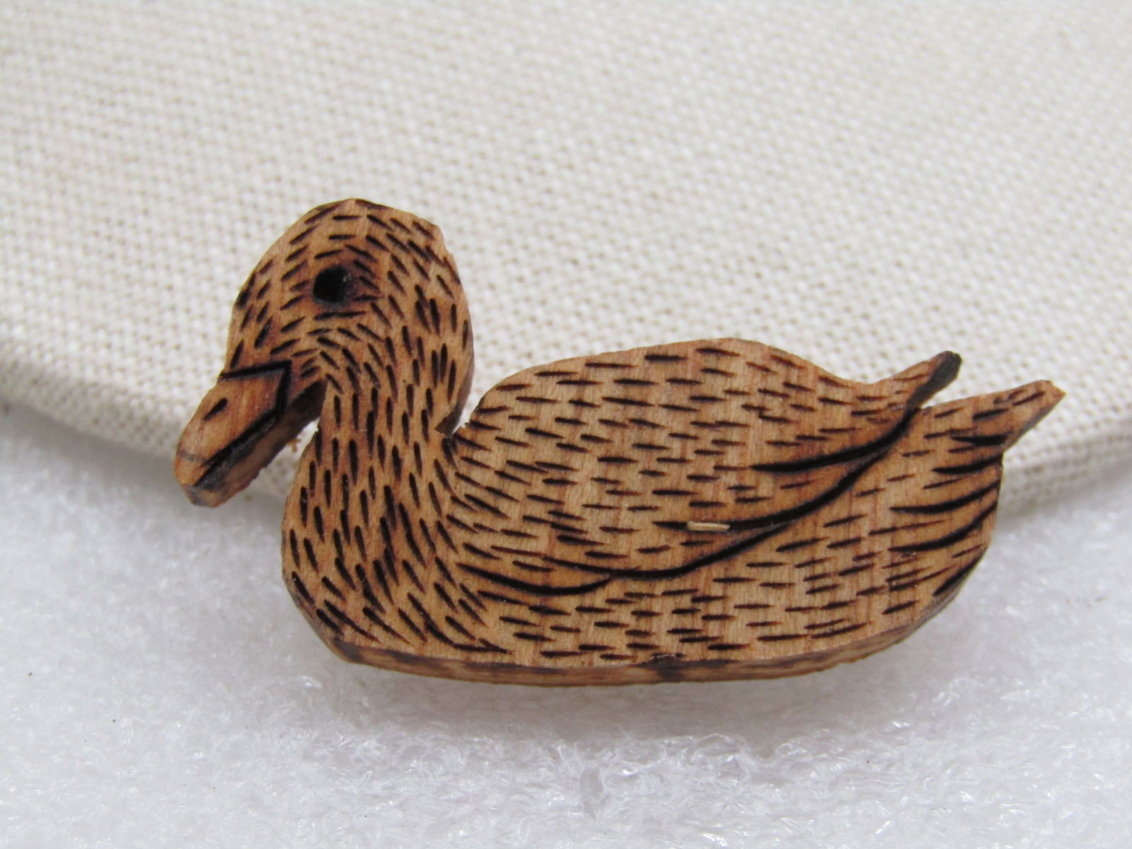Vintage Wood Burned Duck Brooch, Hand Made, 1989, Signed: Title: Vintage Wood Burned Duck Brooch, Hand Made, 1989, Signed Description: Vintage Wood Burned Duck Brooch, Hand Made, 1989, Signed. 1.75" wide and appx. 1" tall. Wood and etched design completed wi