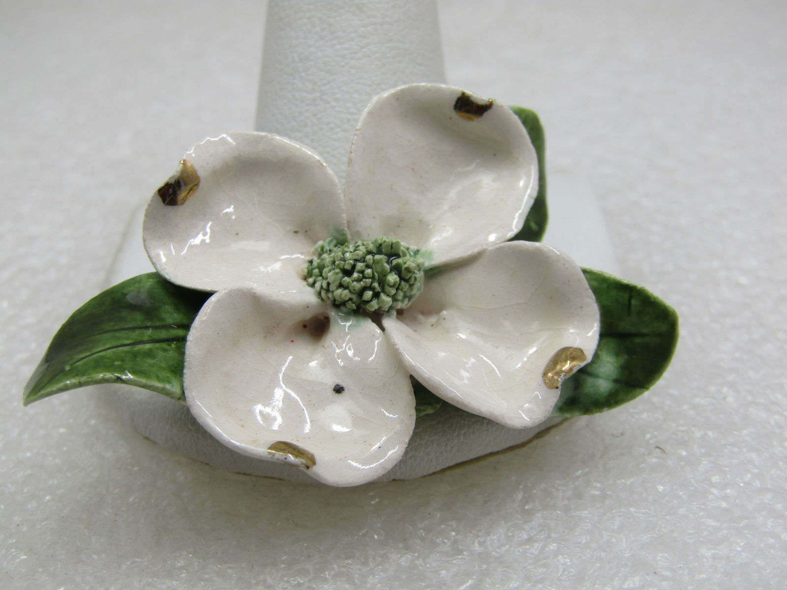 Vintage Handmade Porcelain Dogwood Blossom Brooch, Mid-Century: Title: Vintage Handmade Porcelain Dogwood Blossom Brooch, Mid-Century Description: Vintage Handmade Porcelain Dogwood Blossom Brooch, Mid-Century. 2" by 1.25". White blossom with gold and the curved