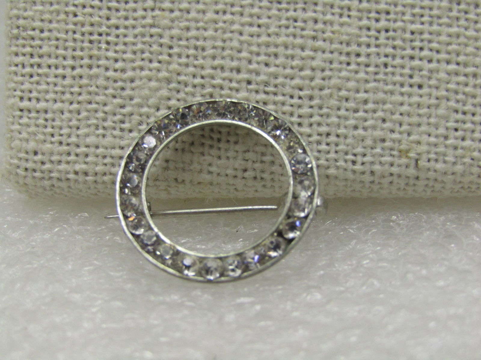 Vintage Silver Tone Rhinestone Circle Brooch, Mid-Century, 3/4": Title: Vintage Silver Tone Rhinestone Circle Brooch, Mid-Century, 3/4" Description: Vintage Silver Tone Rhinestone Circle Brooch, Mid-Century, 3/4" with clear rhinestones inside the circle, locking