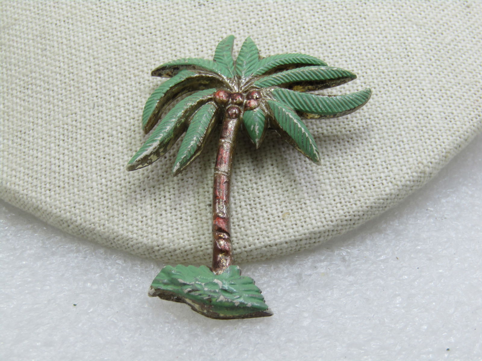 Vintage Painted Coconut Palm Tree Brooch, 1940's-1950's, 2.5": Title: Vintage Painted Coconut Palm Tree Brooch, 1940's-1950's, 2.5" Description: Vintage Painted Coconut Palm Tree Brooch, 1940's-1950's, 2.5" tall and 1-7/8" wide at the top. Enameled with green