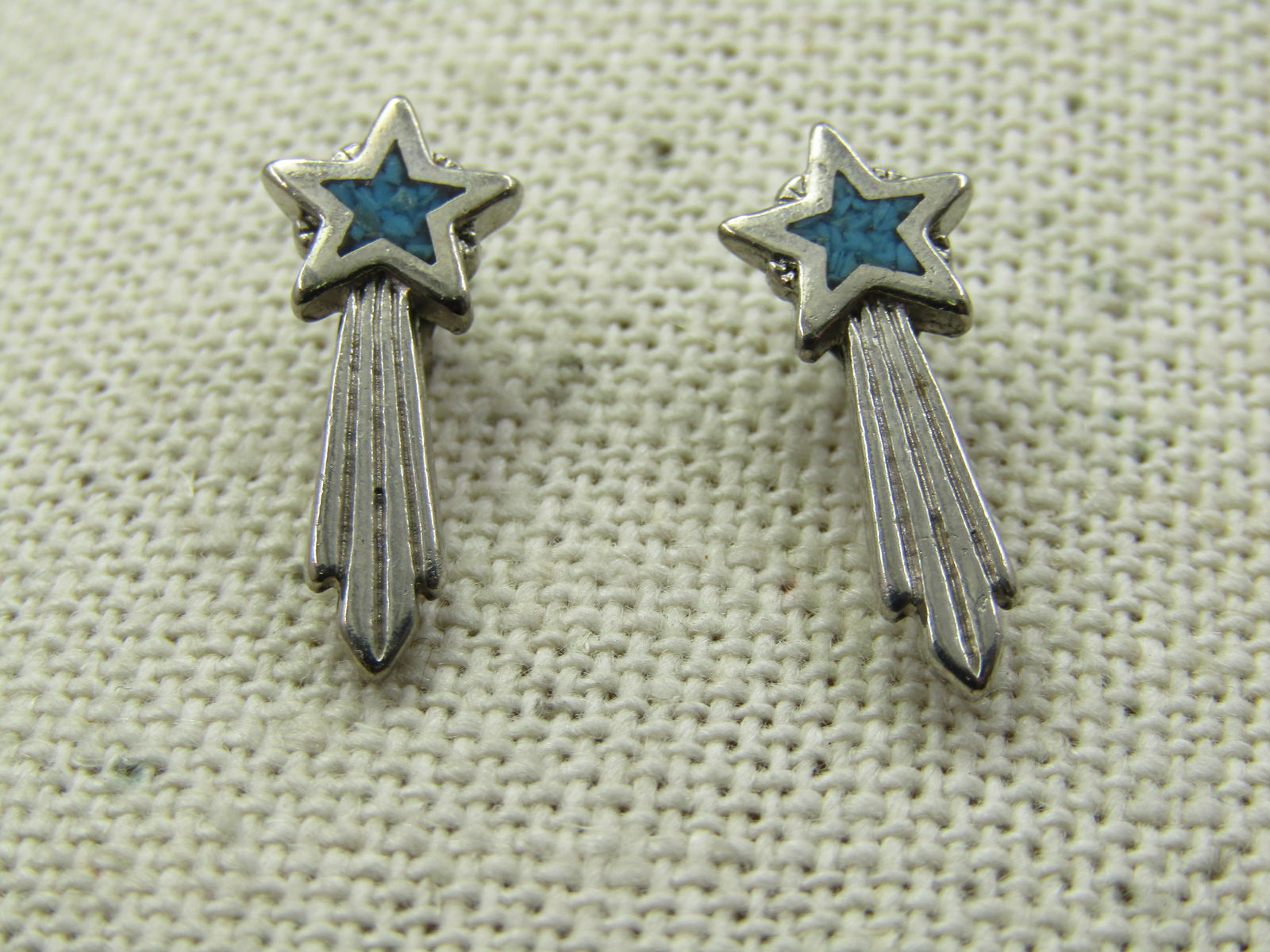 Turquoise Chip Shooting Star Earrings, 1983 Signed, Pierced: Title: Turquoise Chip Shooting Star Earrings, 1983 Signed, Pierced Description: Turquoise Chip Shooting Star Earrings, 1983 Signed, Pierced. The star is appx. 8mm across with the center having