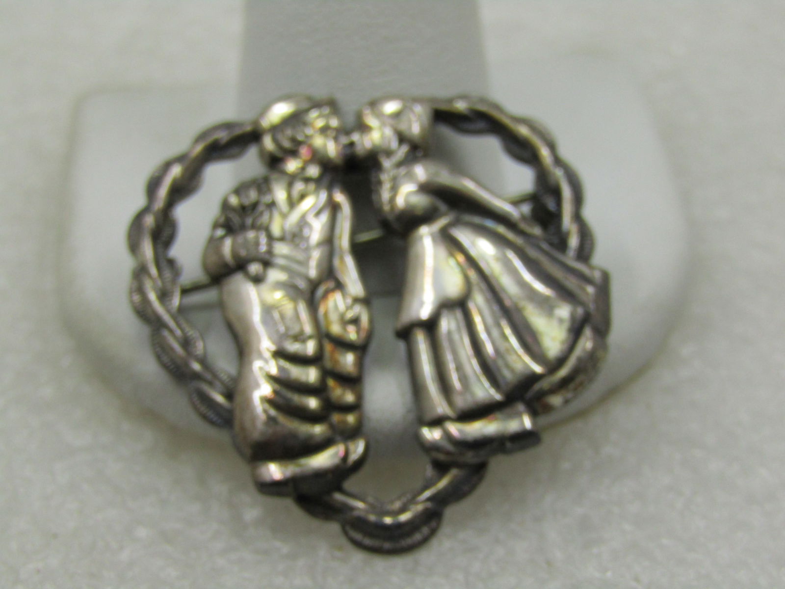 Vintage Sterling Kissing Dutch Girl/Boy Heart Brooch, 1940's: Title: Vintage Sterling Kissing Dutch Girl/Boy Heart Brooch, 1940's Description: Vintage Sterling Kissing Dutch Girl/Boy Heart Brooch, 1940's. Hart frame with ridged and smooth accents frame this