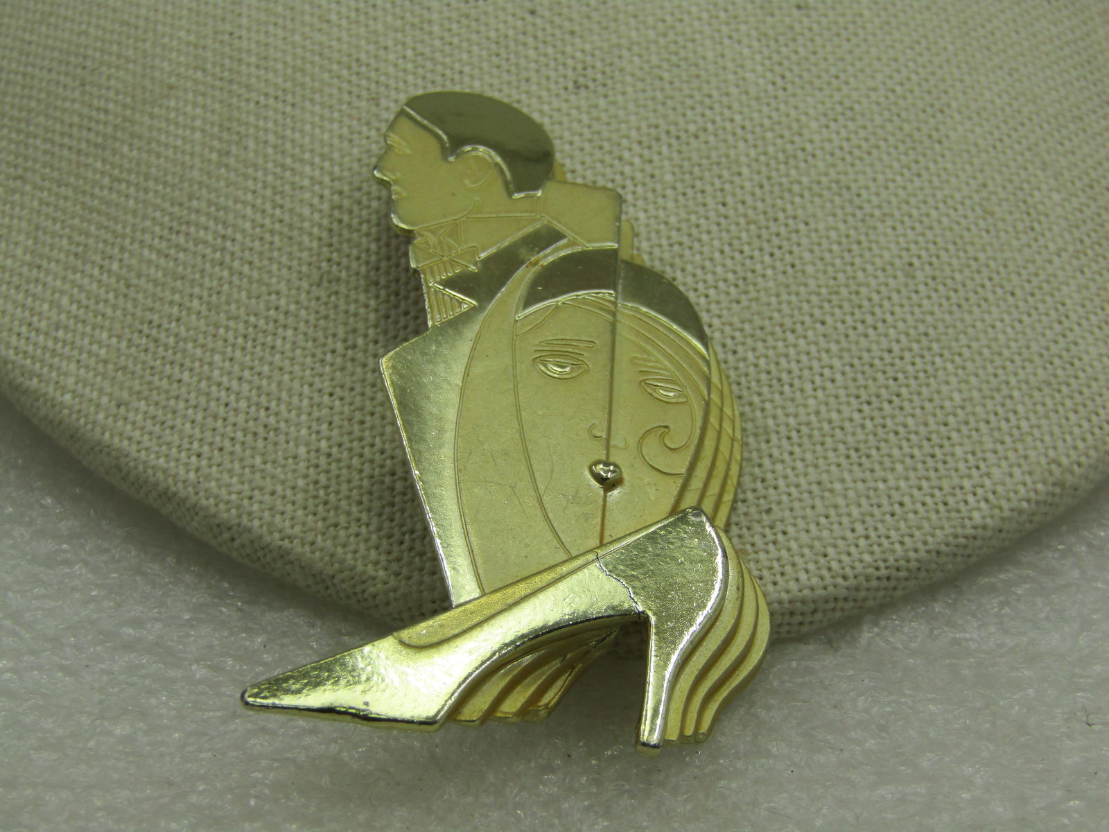 Vintage Art Deco Themed Brooch, Signed CAJC, Man, Woman, Shoe: Title: Vintage Art Deco Themed Brooch, Signed CAJC, Man, Woman, Shoe Description: Vintage Art Deco Themed Brooch, Signed CAJC, Man, Woman, Shoe. This has a stacked design in both smooth and shiny