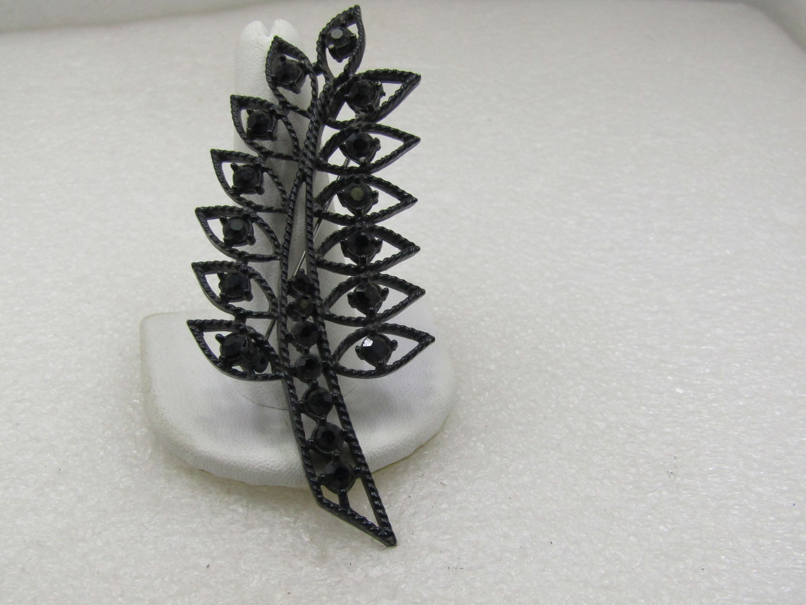 Vintage Black Metal & Rhinestone Leaf Brooch, 3.5" tall: Title: Vintage Black Metal & Rhinestone Leaf Brooch, 3.5" tall Description: Vintage Black Metal & Rhinestone Leaf Brooch, 3.5" tall and 1.25" wide. Tapered stemp with black graduated rhinestones set