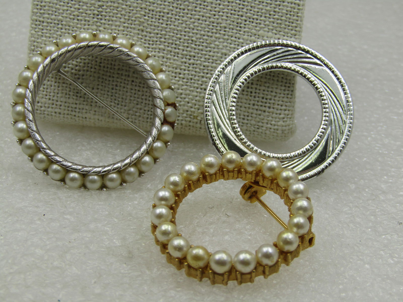 Vintage Three Circle Brooch Lot, One Signed Trifari, 1960's-1970's.: Title: Vintage Three Circle Brooch Lot, One Signed Trifari, 1960's-1970's. Description: Vintage Three Circle Brooch Lot, One Signed Trifari, 1960's-1970's. Trifari signed silver tone faux pearl