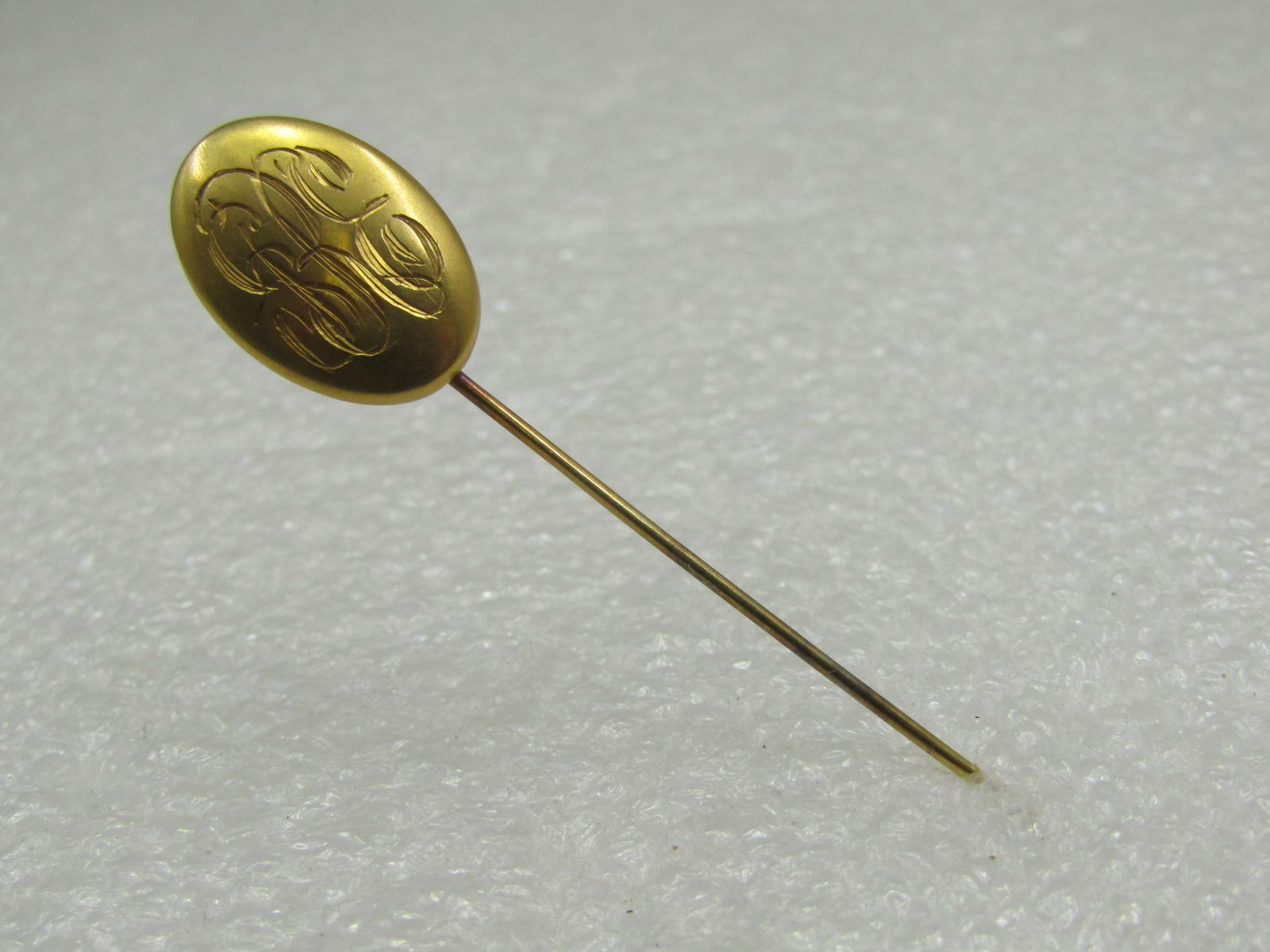 Vintage 10kt Engraved SRE Stick Pin, 2.5",: Title: Vintage 10kt Engraved SRE Stick Pin, 2.5", Description: Vintage 10kt Engraved SRE Stick Pin, 2.5", marked 10kt, tested, weight is appx. .96 gr. Oval 3/4" by 1/2" topper where it is very