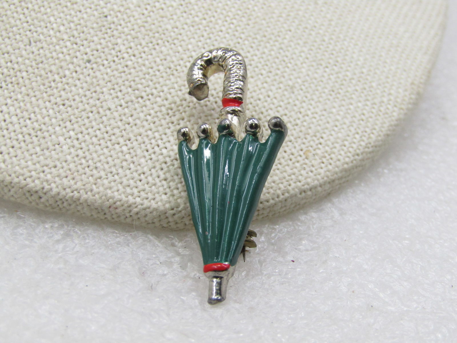 Vintage Enameled Umbrella Brooch, 1940's-1950's, 1.5": Title: Vintage Enameled Umbrella Brooch, 1940's-1950's, 1.5" Description: Vintage Enameled Umbrella Brooch, 1940's-1950's, 1.5" by 3/4". Green enameling on the umbrella with red enameling on the tip